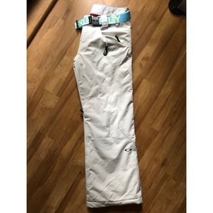 Women’s Oakley snowboarding pants and Oakley belt